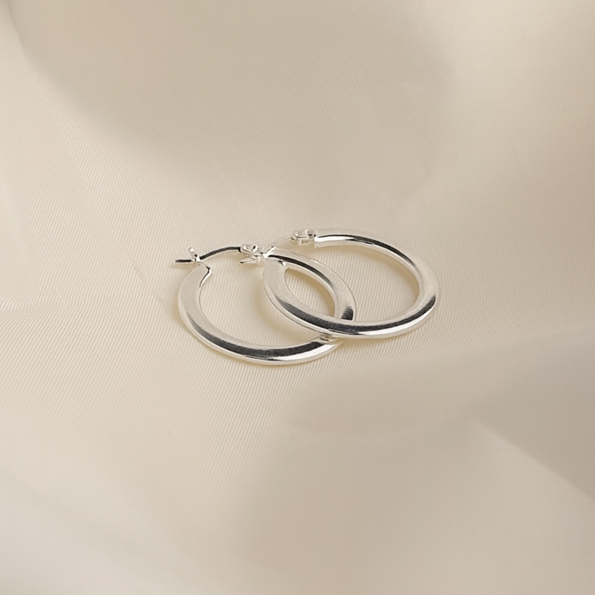 Arracada Orbe Plana 25mm